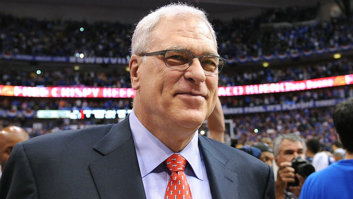 Phil Jackson walks off the court