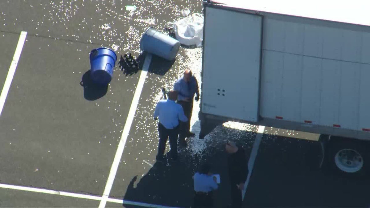 investigators looking inside trailer