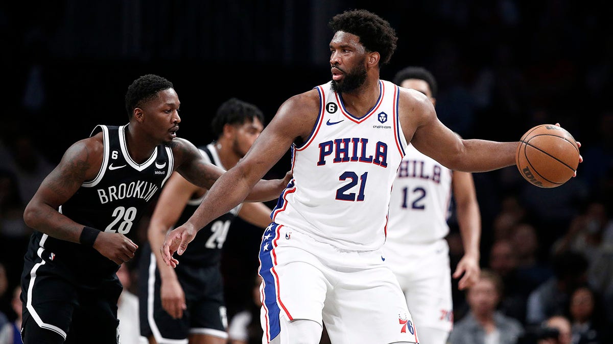 Joel Embiid dribbles during a playoff game