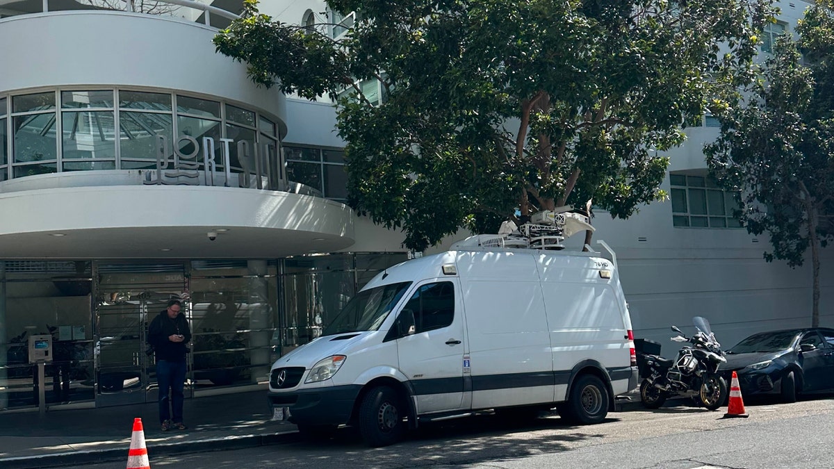 Facade of the Portside building in San Francisco with news van out front