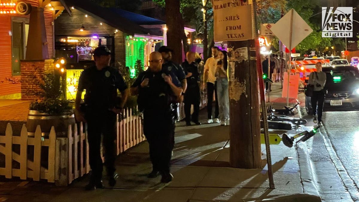 Police patrolling down Rainey Street