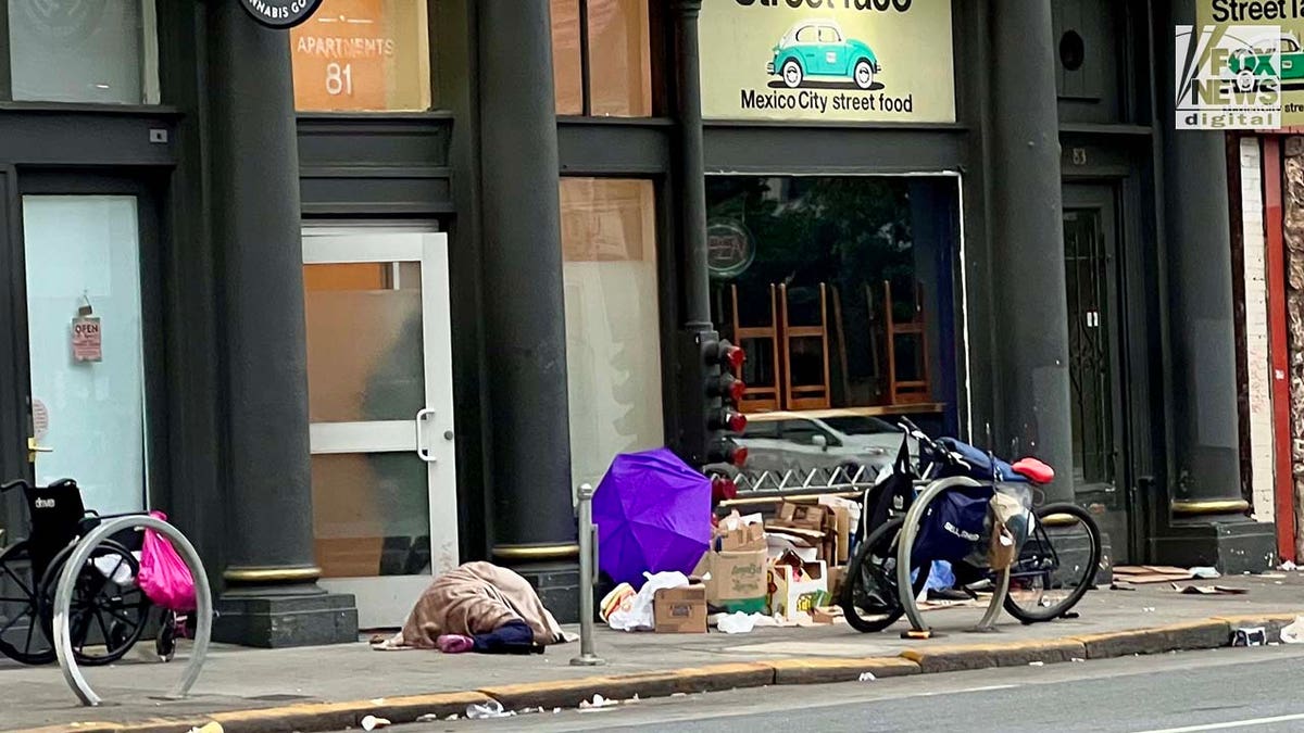 People inhabit encampments on the streets of San Francisco's Mission District.