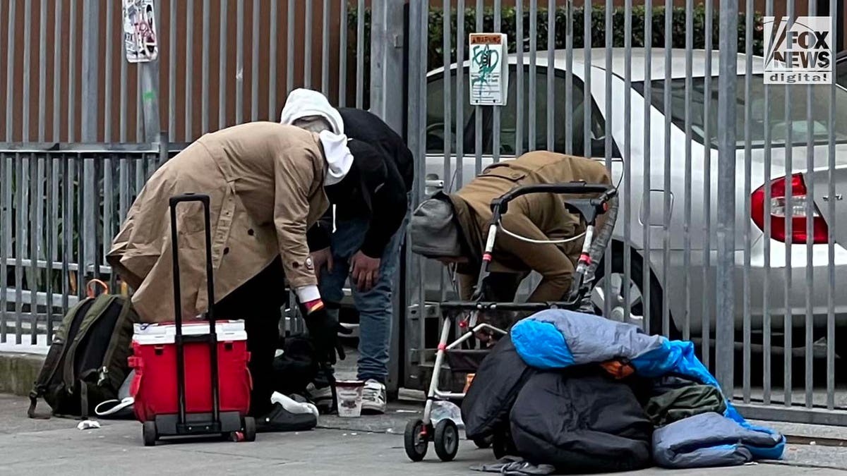 People inhabit encampments on the streets of San Franciscos Mission District.