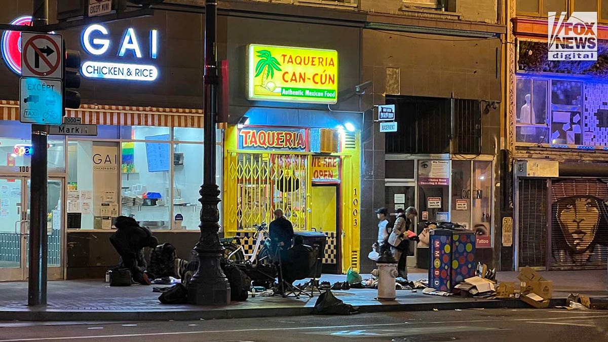 People inhabit encampments on the streets of San Francisco's Tenderloin District.