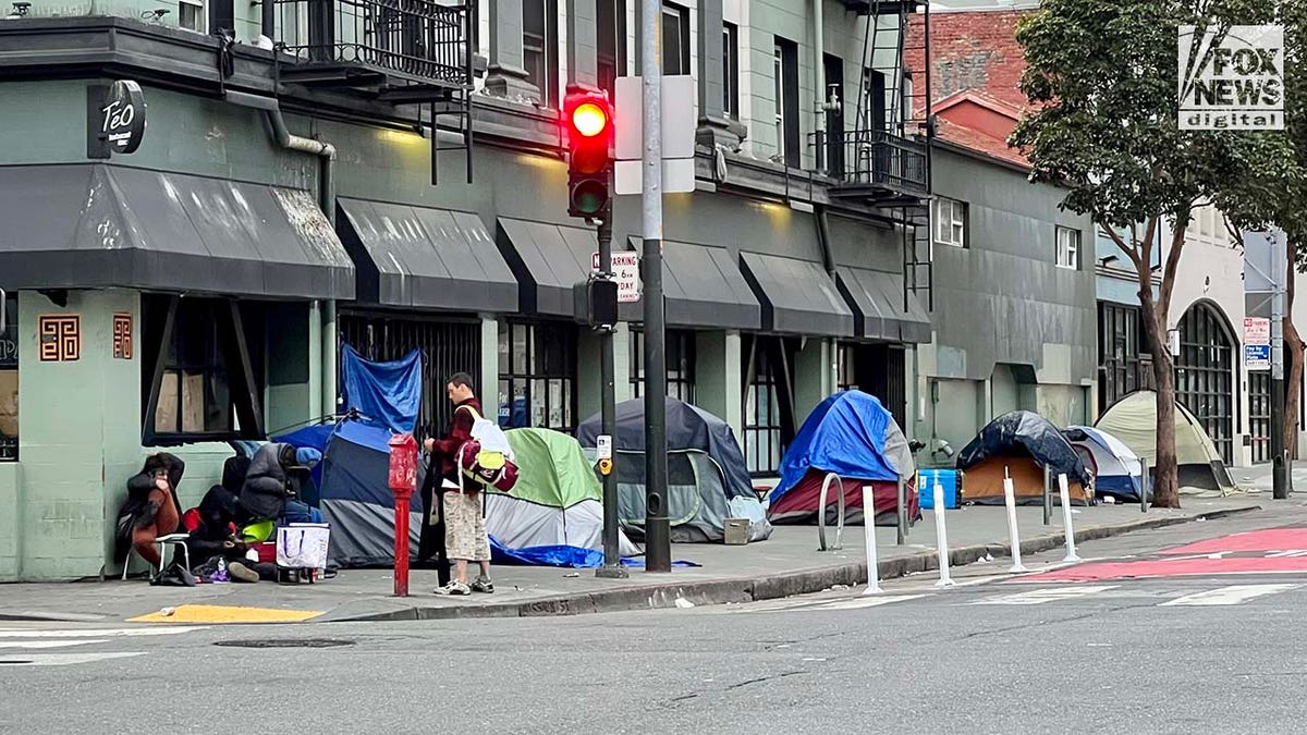 People inhabit encampments on the streets of San Franciscos Tenderloin District.