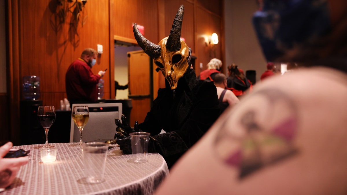 Demon-headed attendee at SatanCon