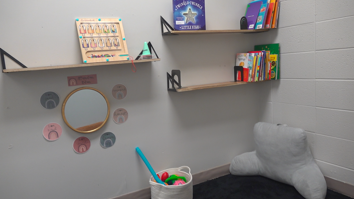 Inside the safe room with children's toys, books and pillows