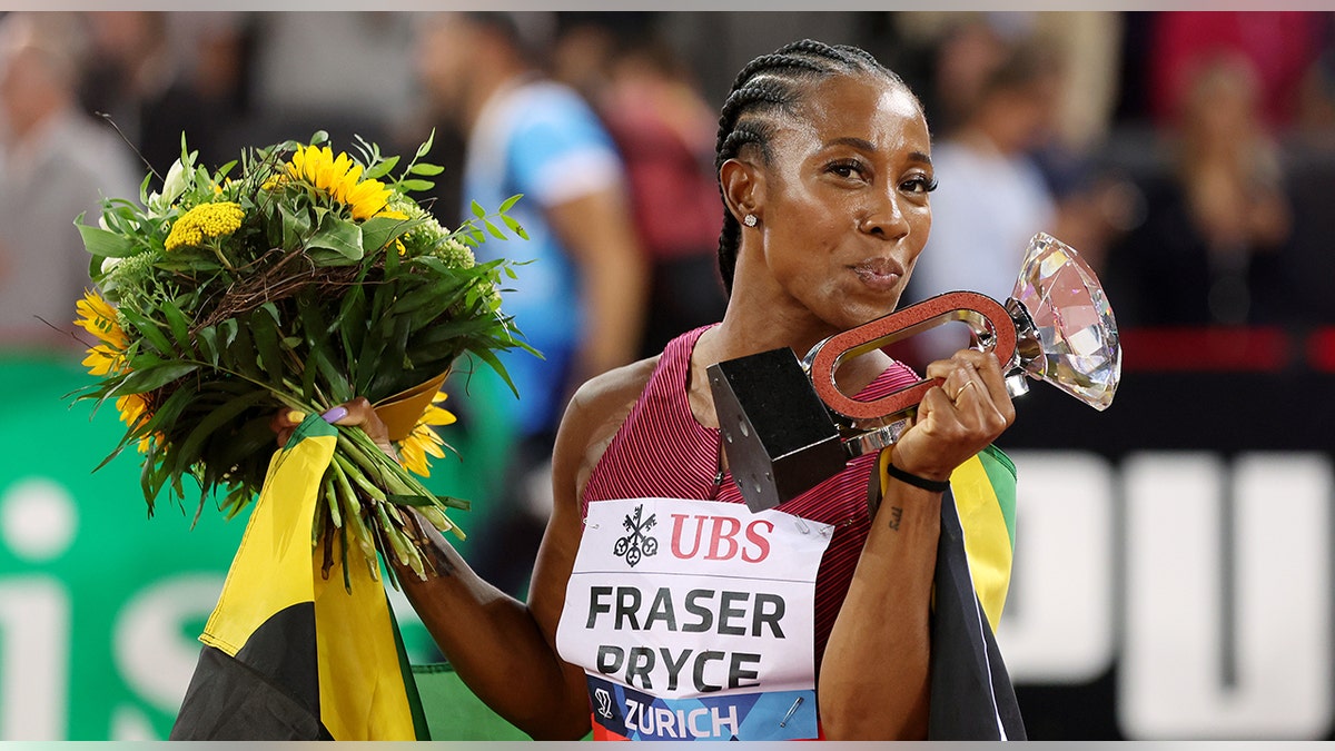 Shelly-Ann Fraser-Pryce celebrates win