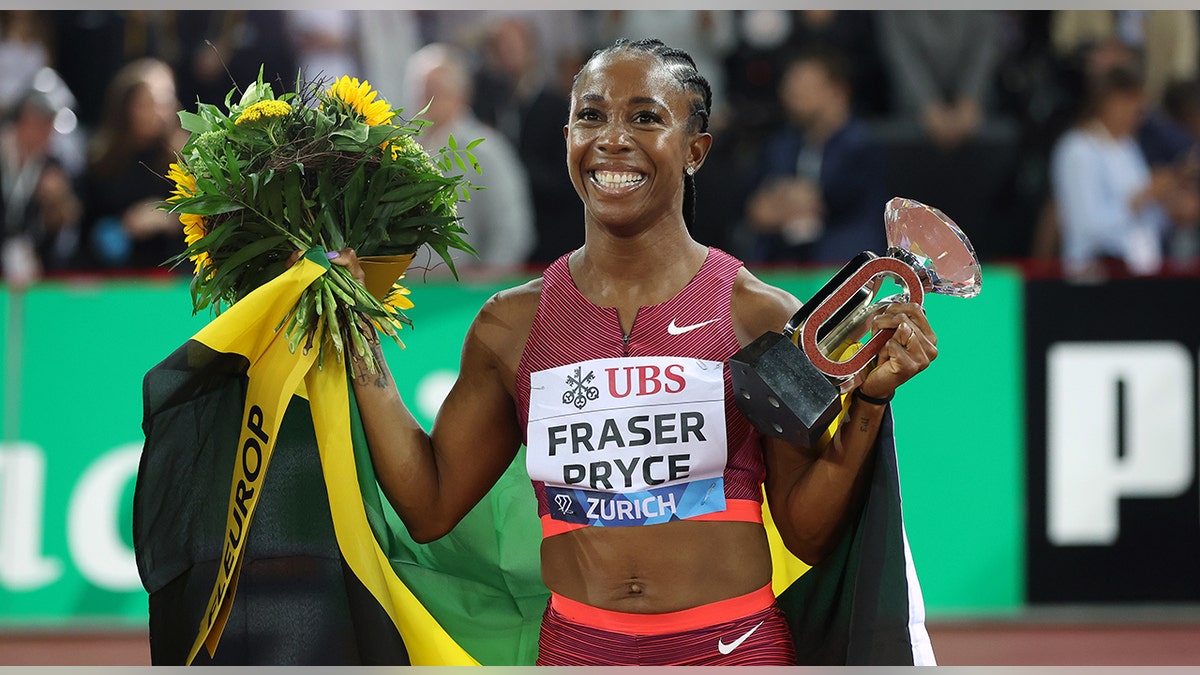 Shelly-Ann Fraser-Pryce celebrates win