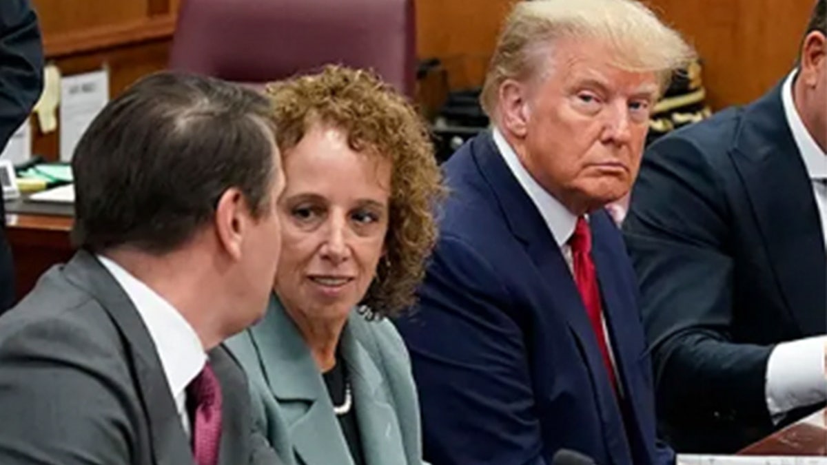 Susan Necheles sits next to Donald Trump at his arraignment
