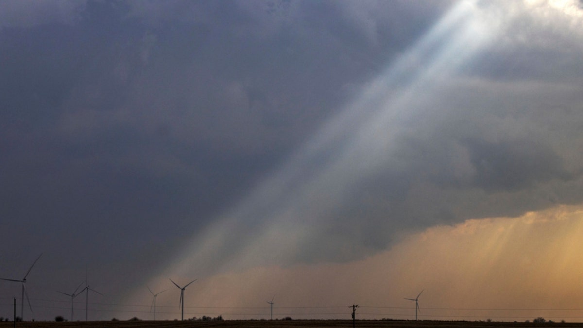 Sunlight filters through storm clouds in Iowa