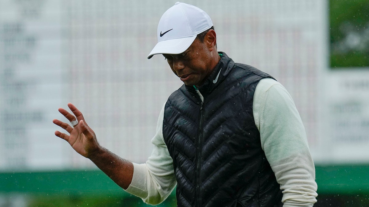 Tiger Woods waves to Augusta National crowd during the Masters golf tournament
