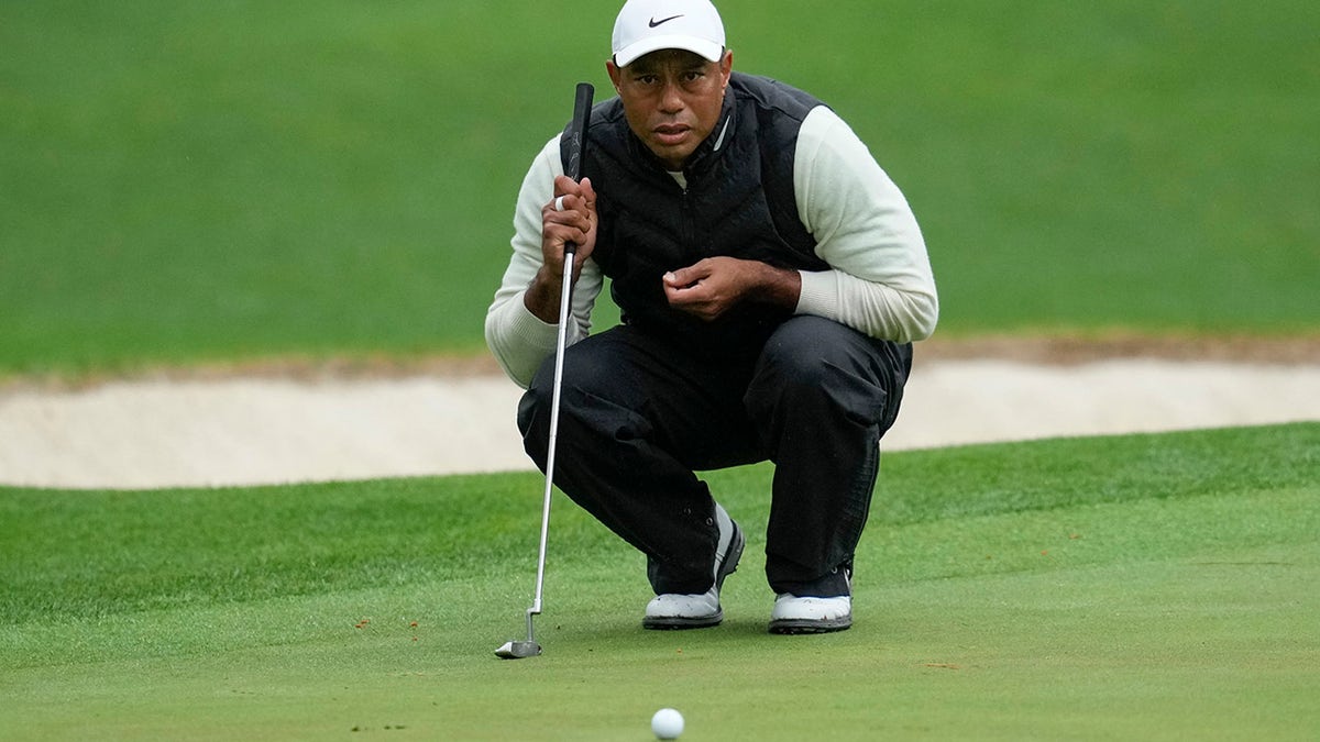 Tiger Woods scouts the ball