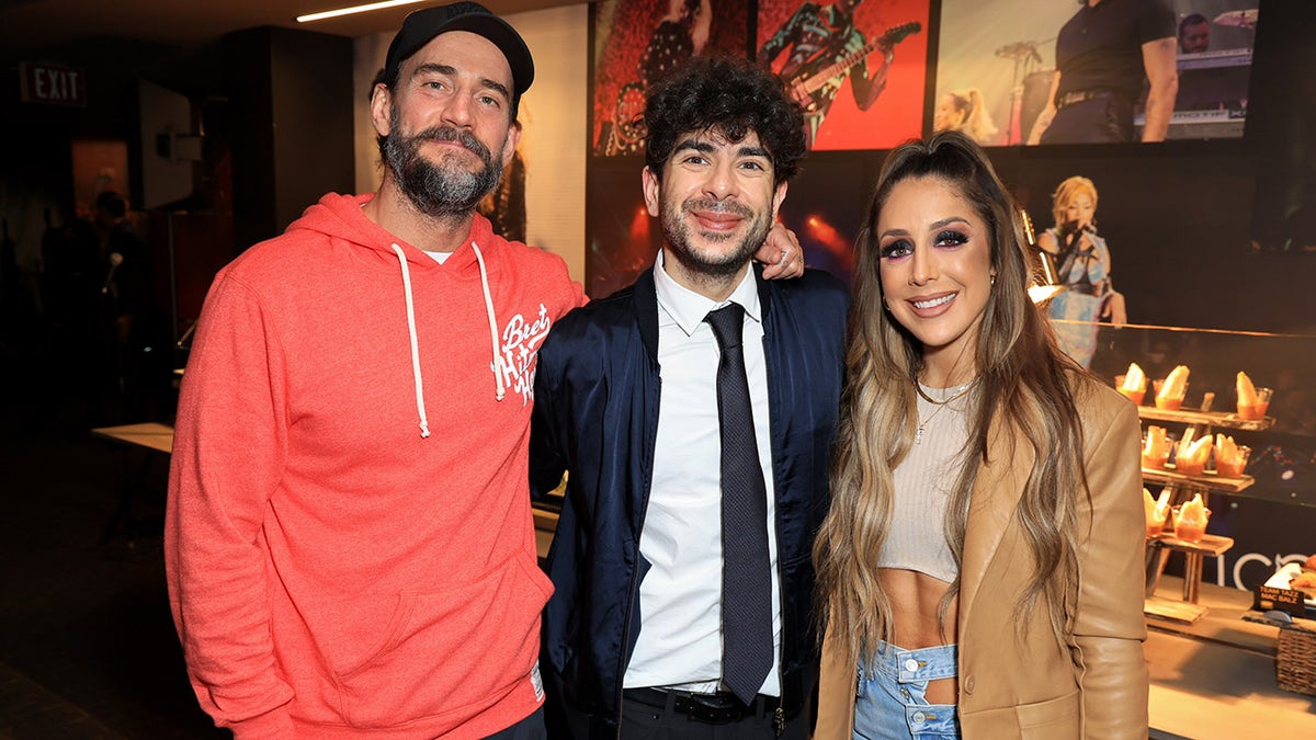 Tony Khan with CM Punk and Britt Baker