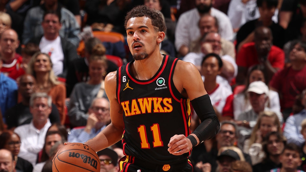 Trae Young dribbles