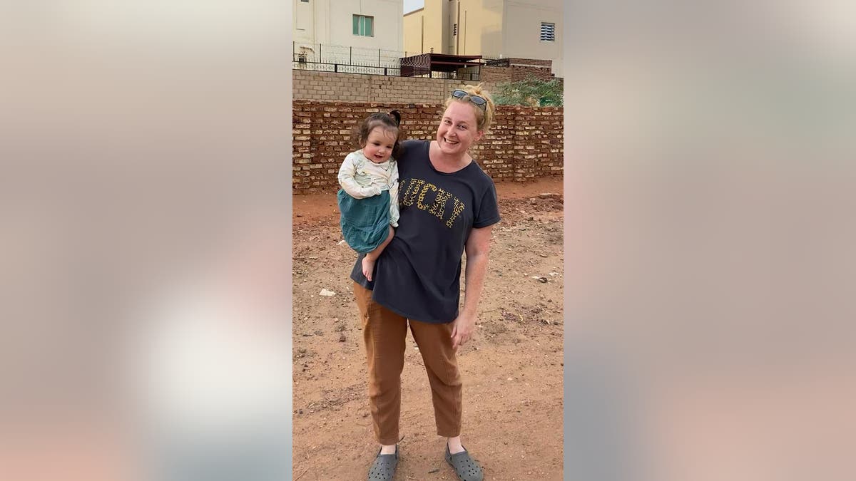 American woman and child in Sudan