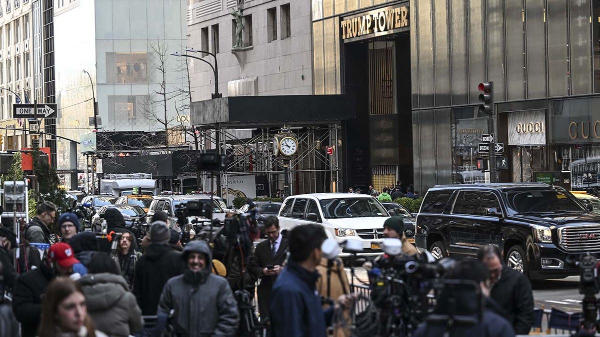 Trump Tower is circled with barriers as security forces take measures ahead of former US President Donald Trump's arrival for a court hearing