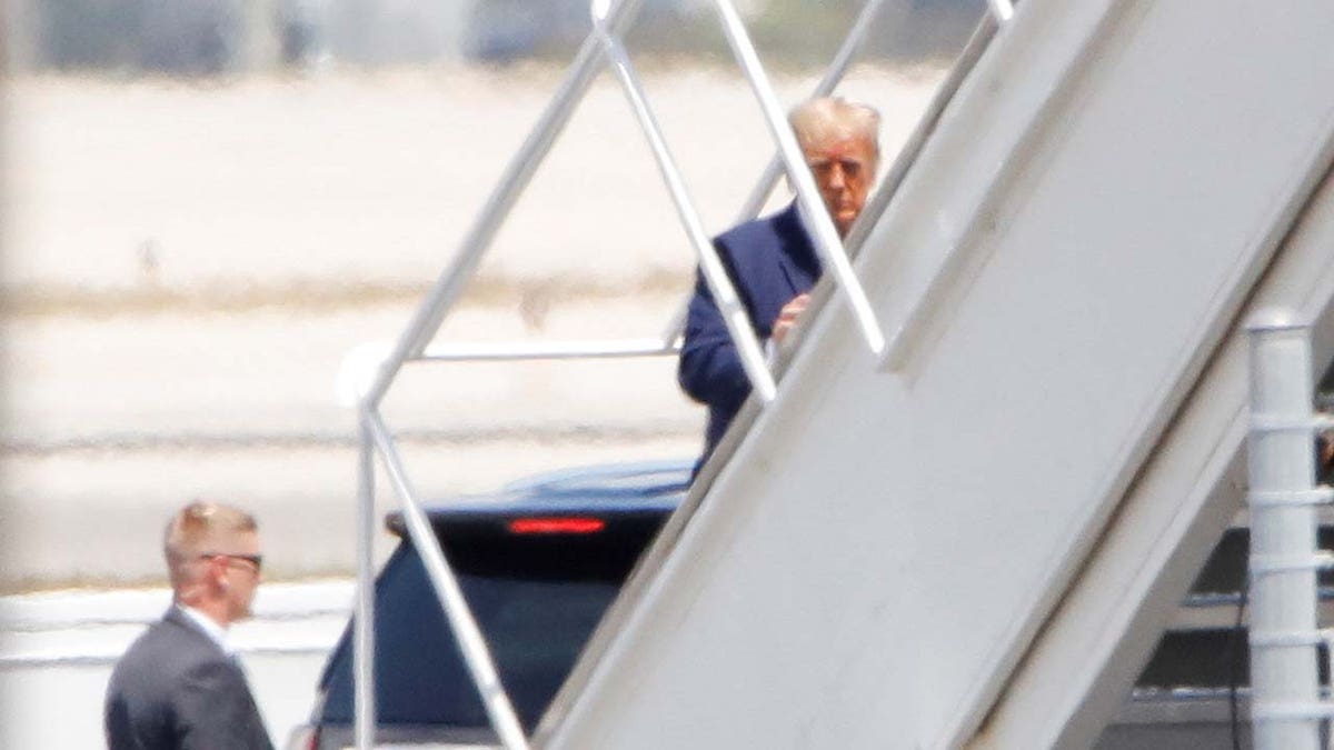 Former U.S. President Donald Trump boards his plane, at the Palm Beach International AirportFormer U.S. President Donald Trump boards his plane, at the Palm Beach International Airport