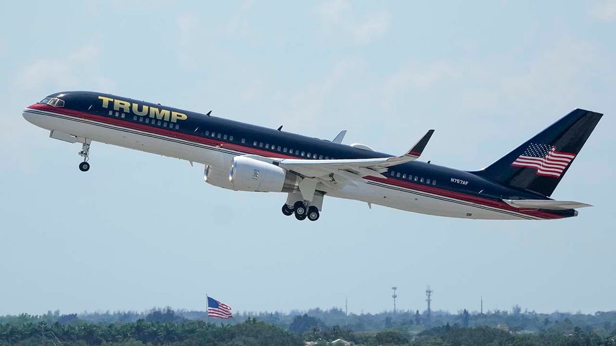 The plane carrying former president Donald Trump lifts off at Palm Beach International Airport