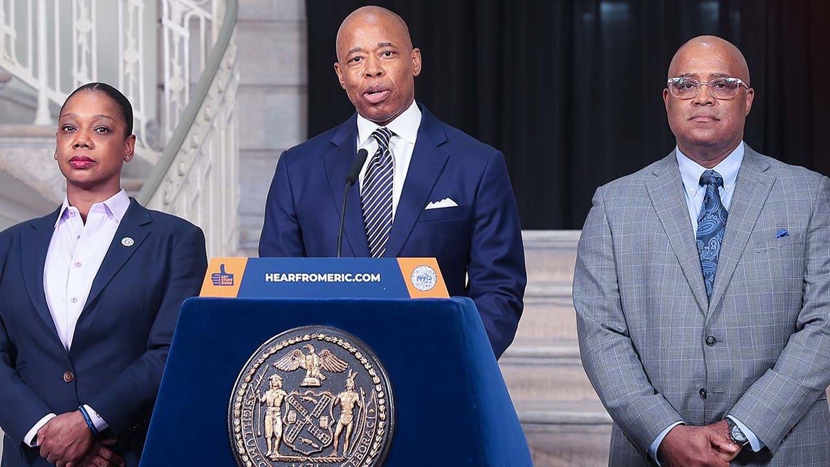 New York City Mayor Eric Adams (L) and New York City Police Department (NYPD) Commissioner Keechant Sewell (R) make a public safety-related announcement ahead of former US President Donald Trump's arrival