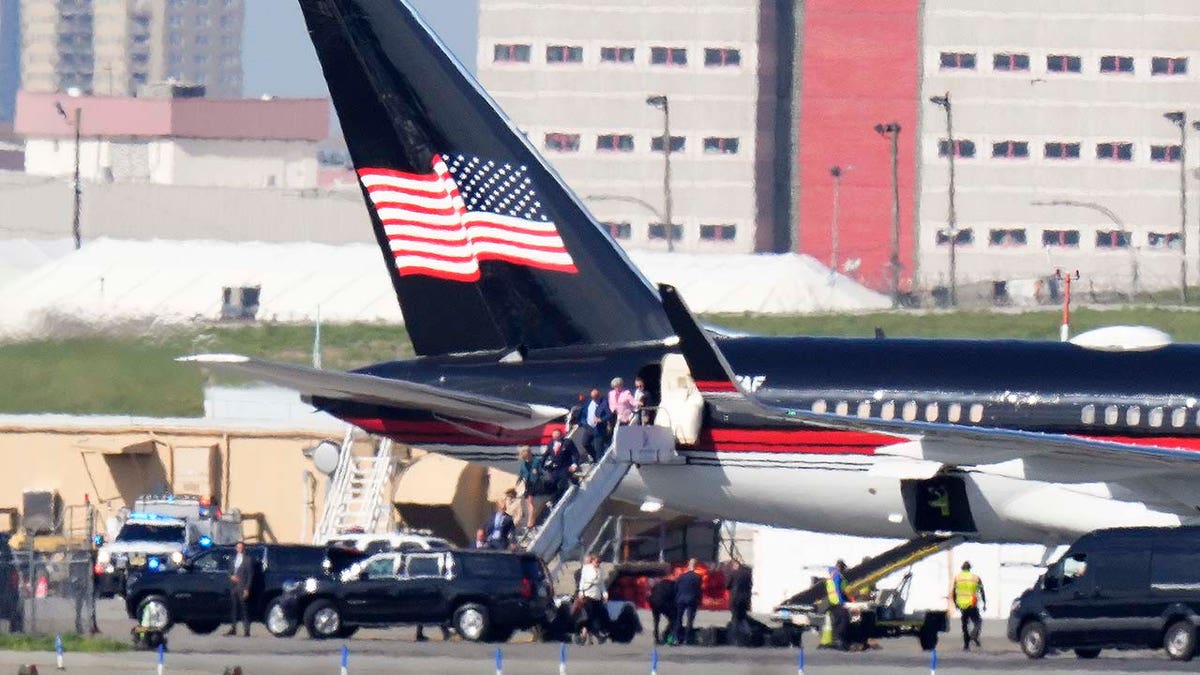Former President Donald Trump's aides and legal team exit his plane