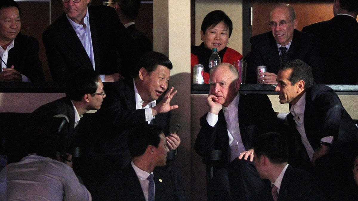 Then-Chinese Vice President Xi Jinping (2nd L), then-California Gov. Jerry Brown (2nd R), then-Los Angeles Mayor Antonio Villaraigosa (R), and then-DreamWorks Animation CEO Jeffrey Katzenberg (2nd Row, R) attend the Los Angeles Lakers and Phoenix Suns NBA basketball game on Feb. 17, 2012 in Los Angeles, Calif.