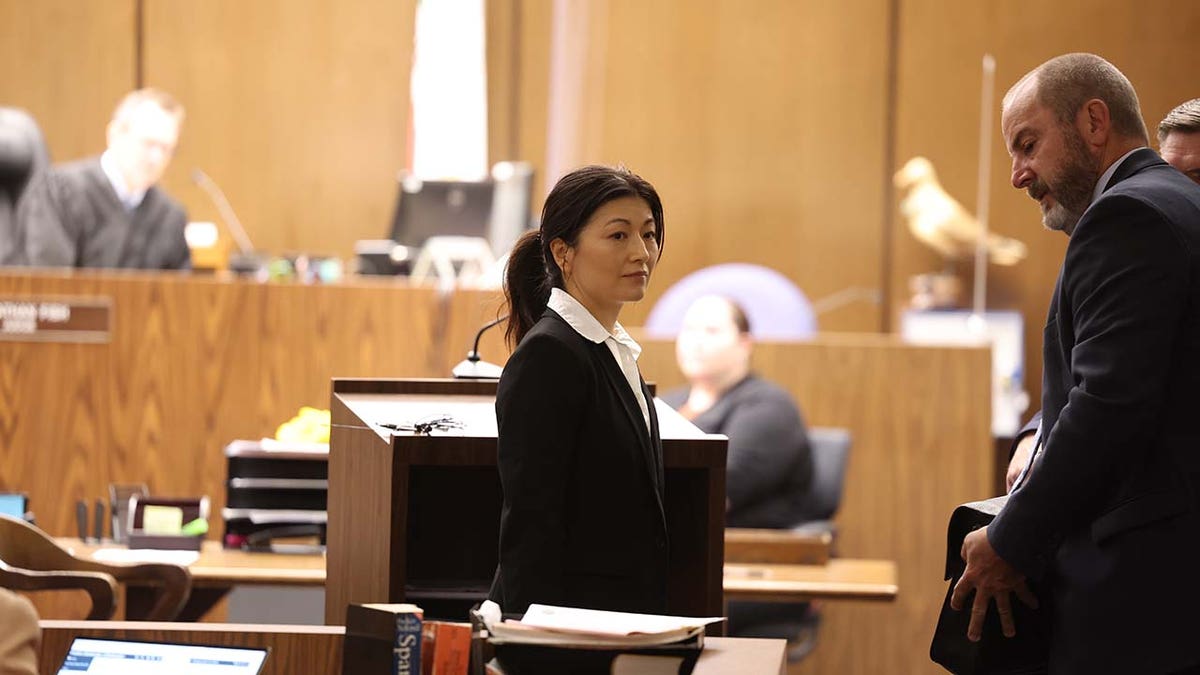 Yue Yu exits the courtroom in the Superior Court of California of the County of Orange Tuesday