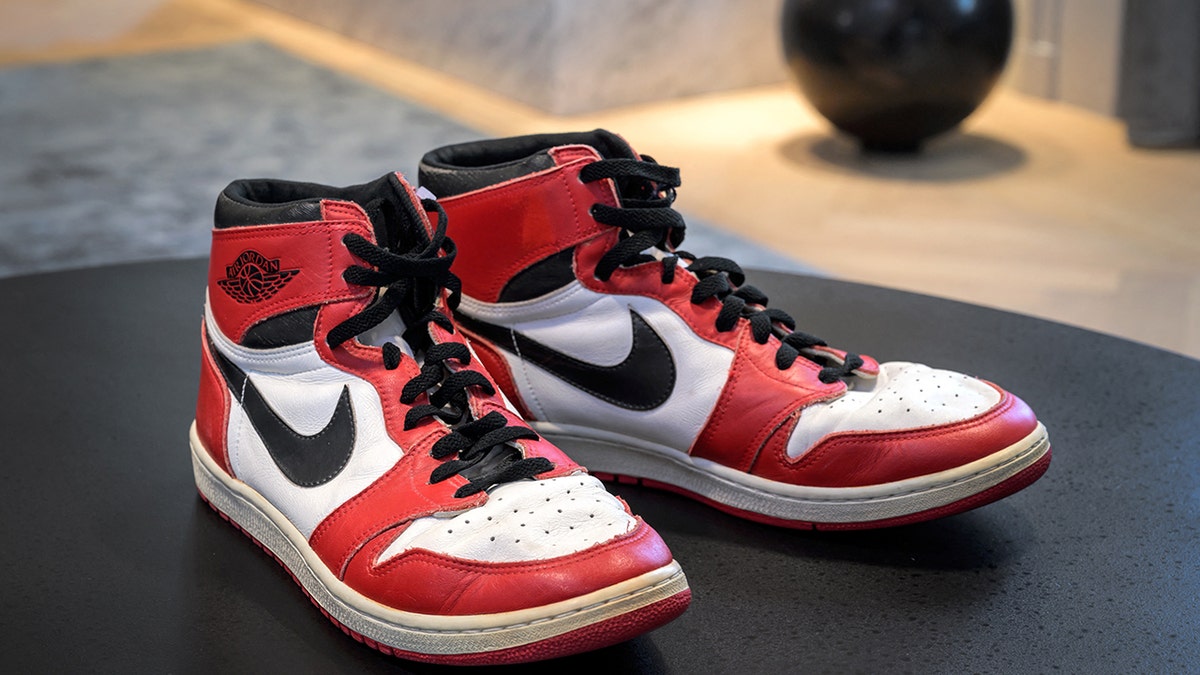 A pair of basketball legend Michael Jordan's famous Air Jordans from his rookie season are seen on April 28, 2021, in Geneva during a preview of sale by auction house Sotheby's, entitled "Gamers Only." 