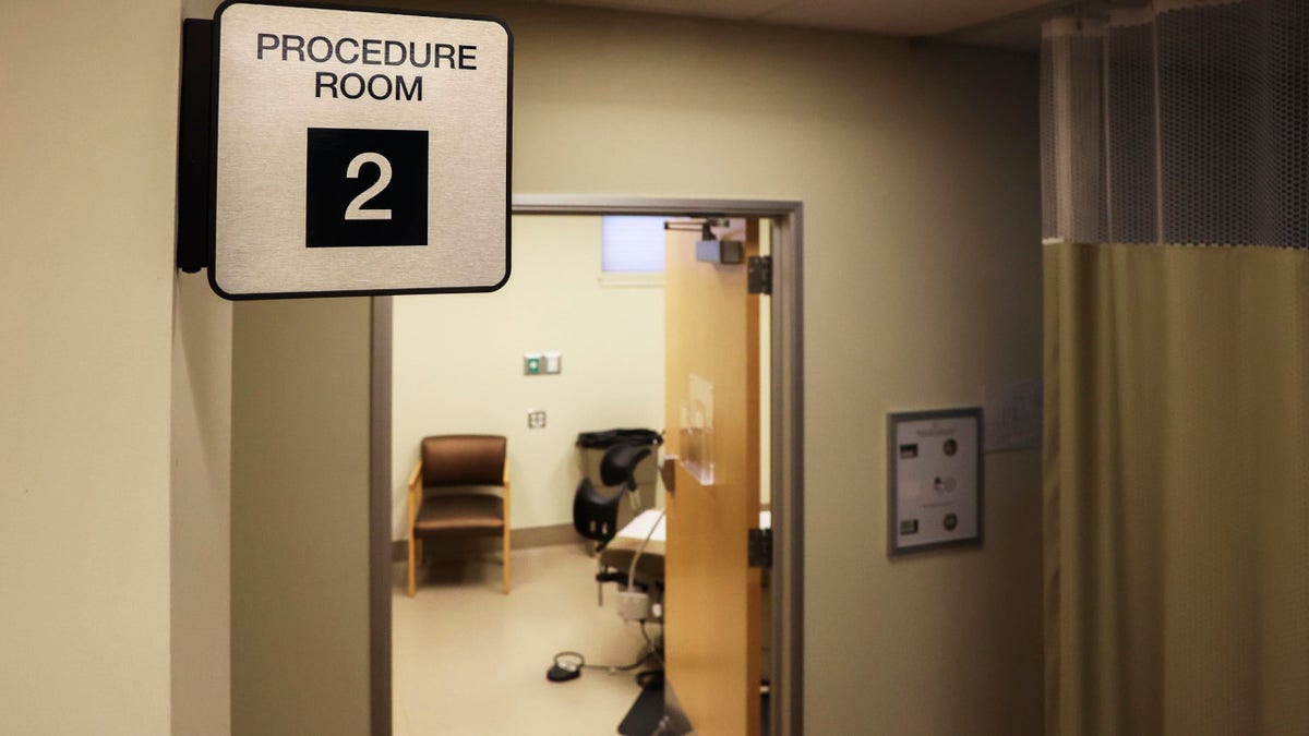 Abortion clinic procedure room seen through open door