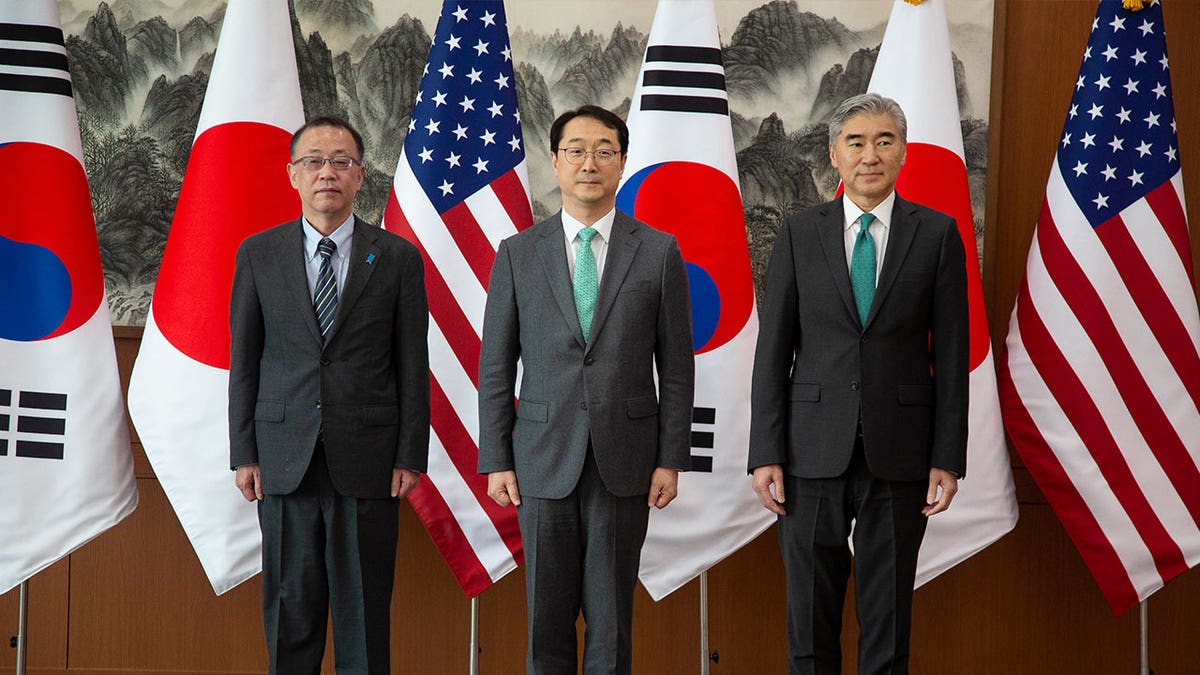 From left to right, Japanese nuclear envoy Takehiro Funakoshi, chief South Korean nuclear negotiator Kim Gunn, and the U.S. special representative to North Korea Sung Kim pose together before their three-way meeting in Seoul, South Korea, on April 7, 2023. 