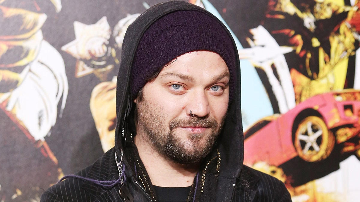 Bam Margera poses in front of art installation