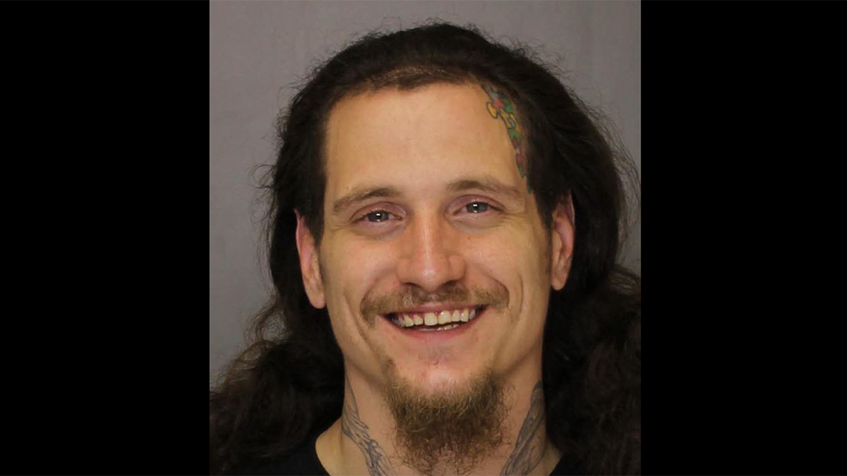 mugshot of a smiling Anthony Santiago