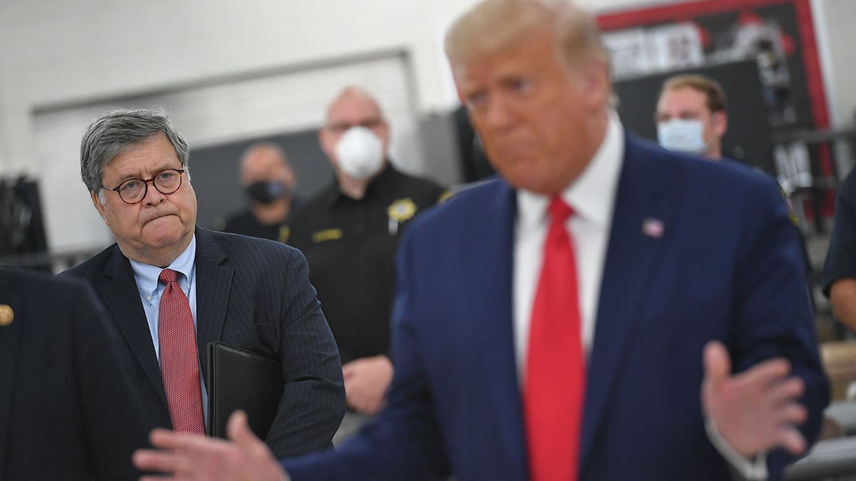Bill Barr stands in background as Donald Trump speaks