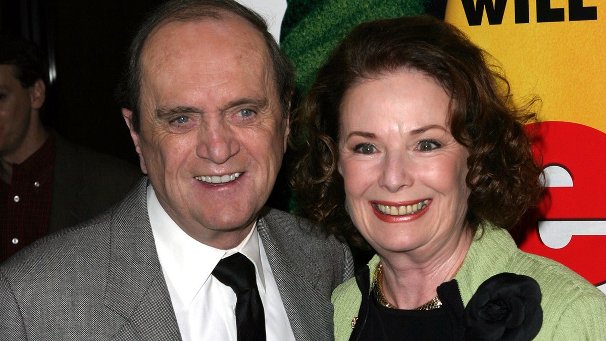 Bob Newhart and Ginnie Newhart smile on red carpet at Elf premiere