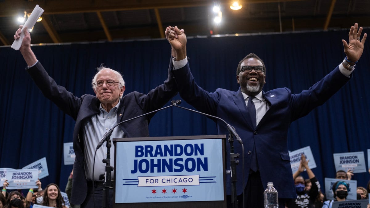 Progressive mayoral candidate Brandon Johnson and Bernie Sanders
