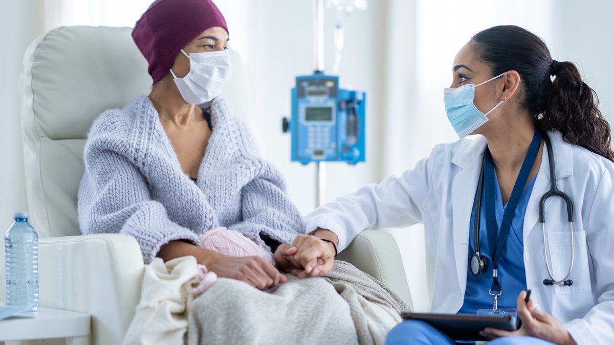 Breast cancer patient with doctor