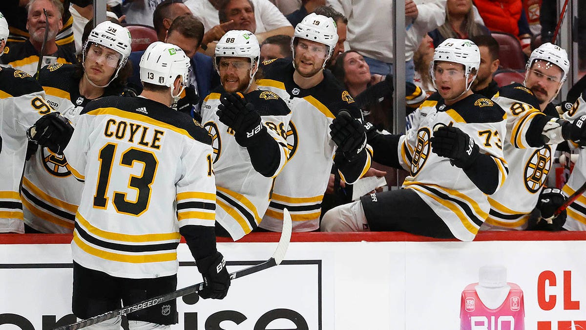 Charlie Coyle greets teammates