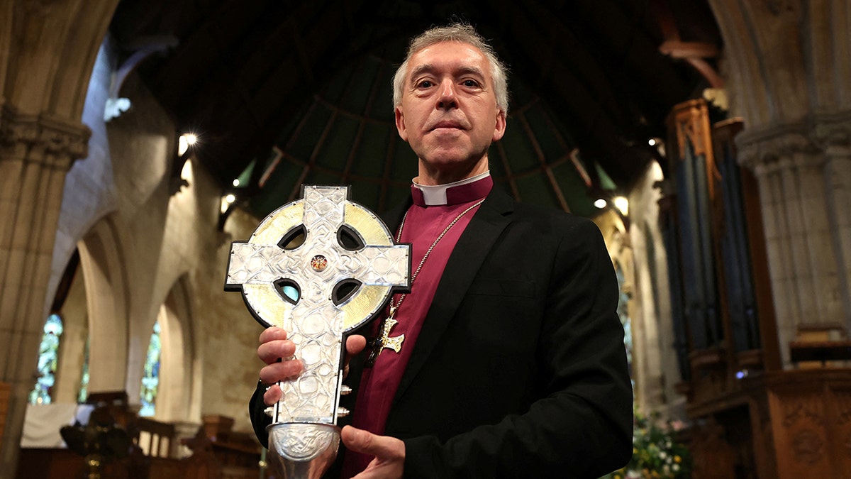 Archbishop of Wales holding the Cross of Wales