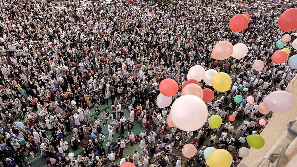 Muslims celebrating Eid al-Fitr with balloons