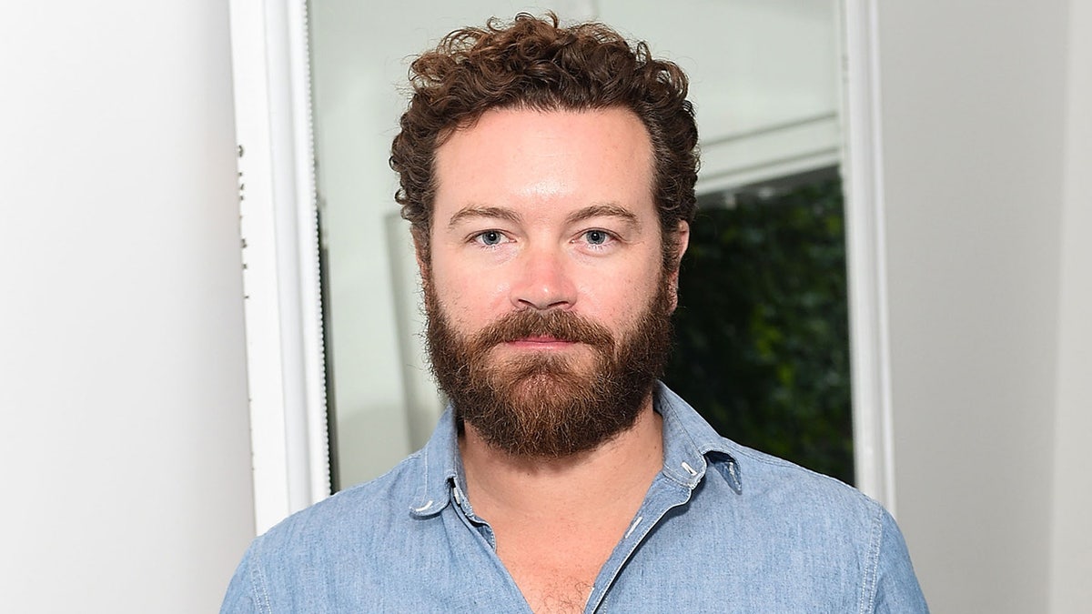 Danny Masterson wears blue shirt at event