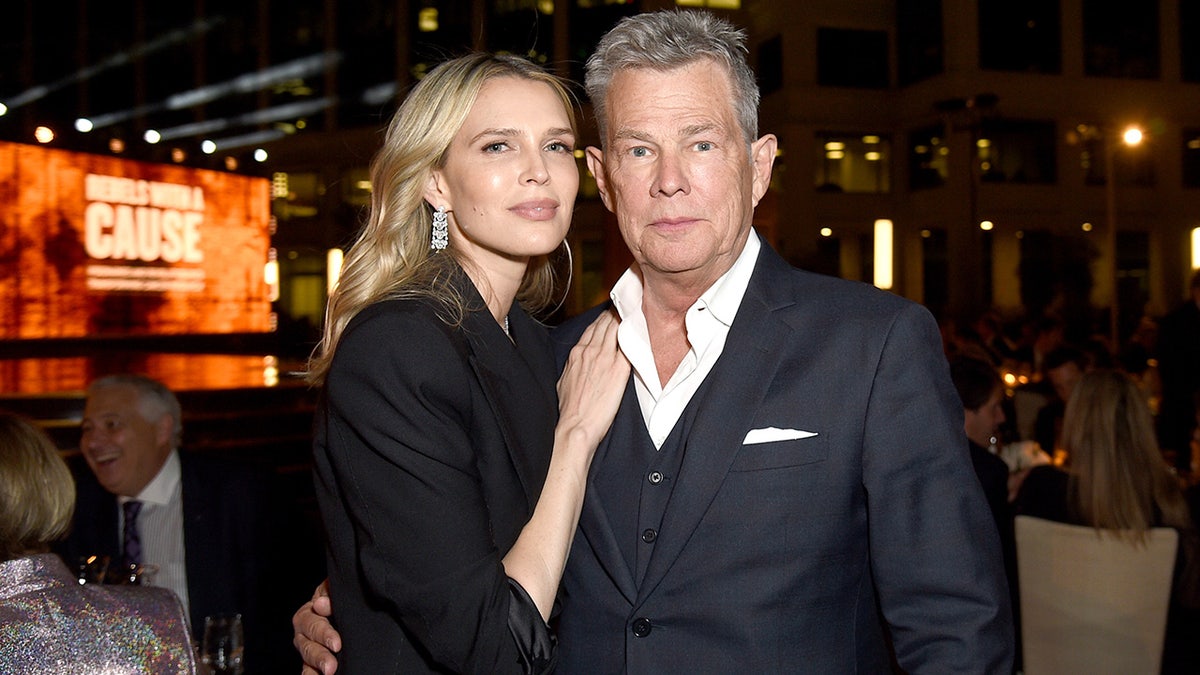 David Foster wears dapper grey suit with daughter Sara Foster in all-black for exclusive event