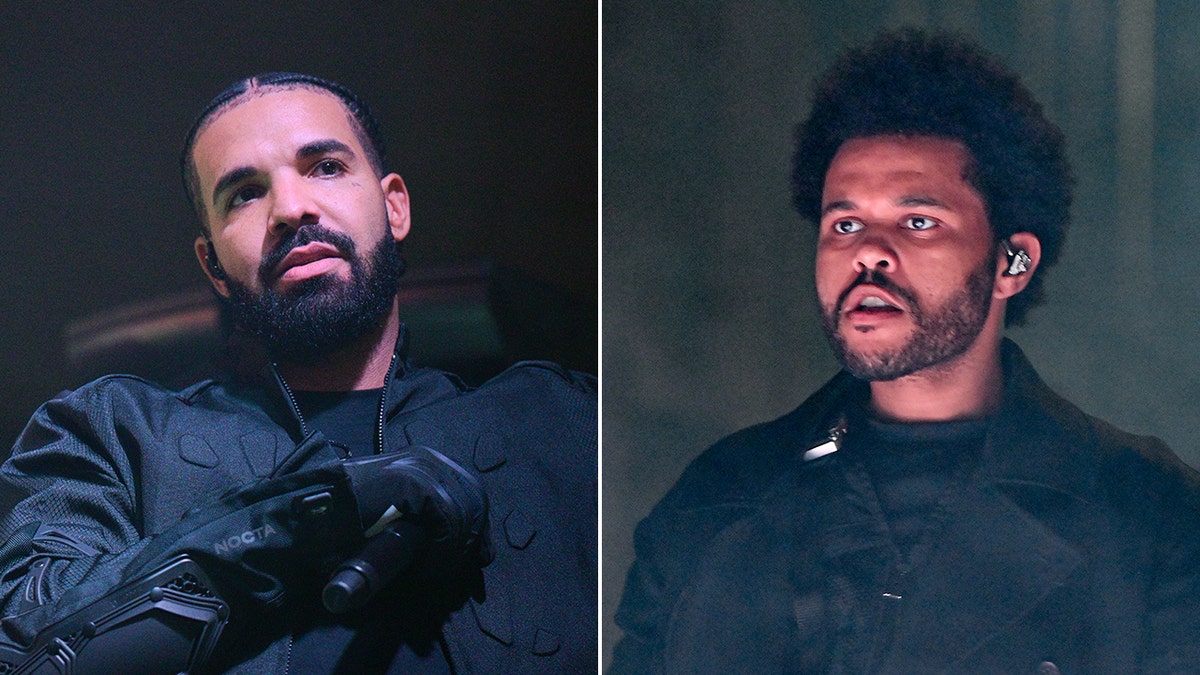 Drake looks off in the distance on stage in all black, holding a microphone with gloves split The Weeknd looks off in the opposite distance with some smoke behind him on stage