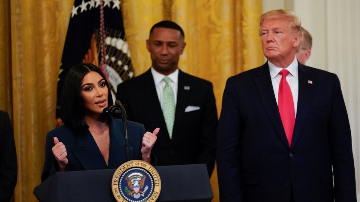 Kim Kardashian joins Trump onstage to speak about second chance hiring, at the White House in Washington