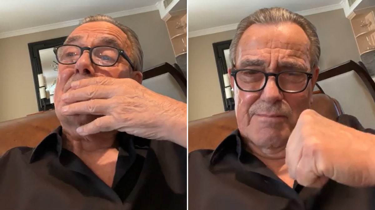 Eric Braeden in a black shirt and black rimmed glasses bring his hand to his face, emotional split puts his fist in the air