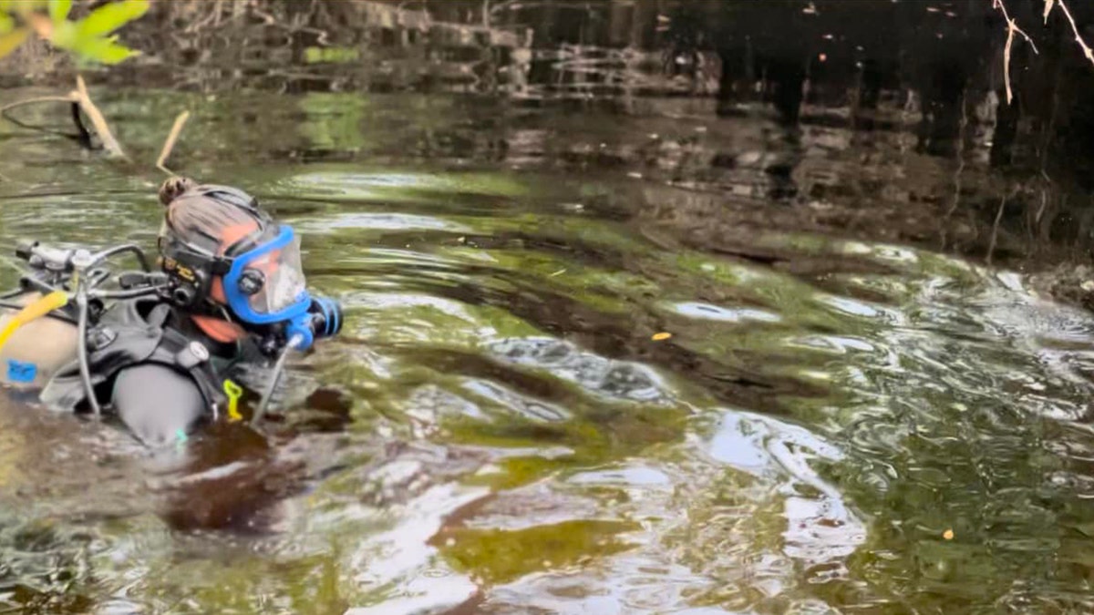 diver searching canal