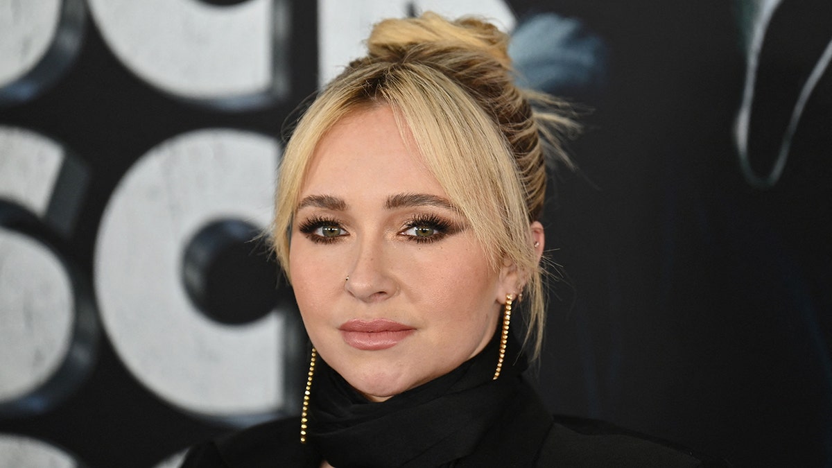 Hayden Panettiere wears achromatic  turtleneck top