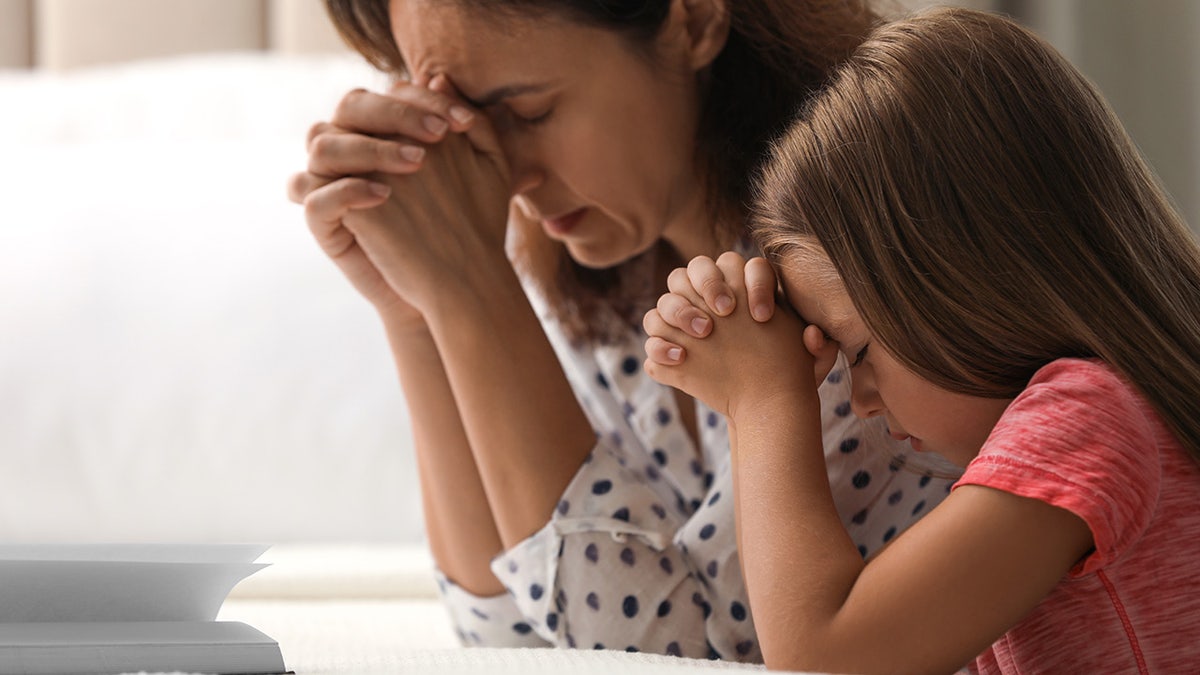 woman daughter pray