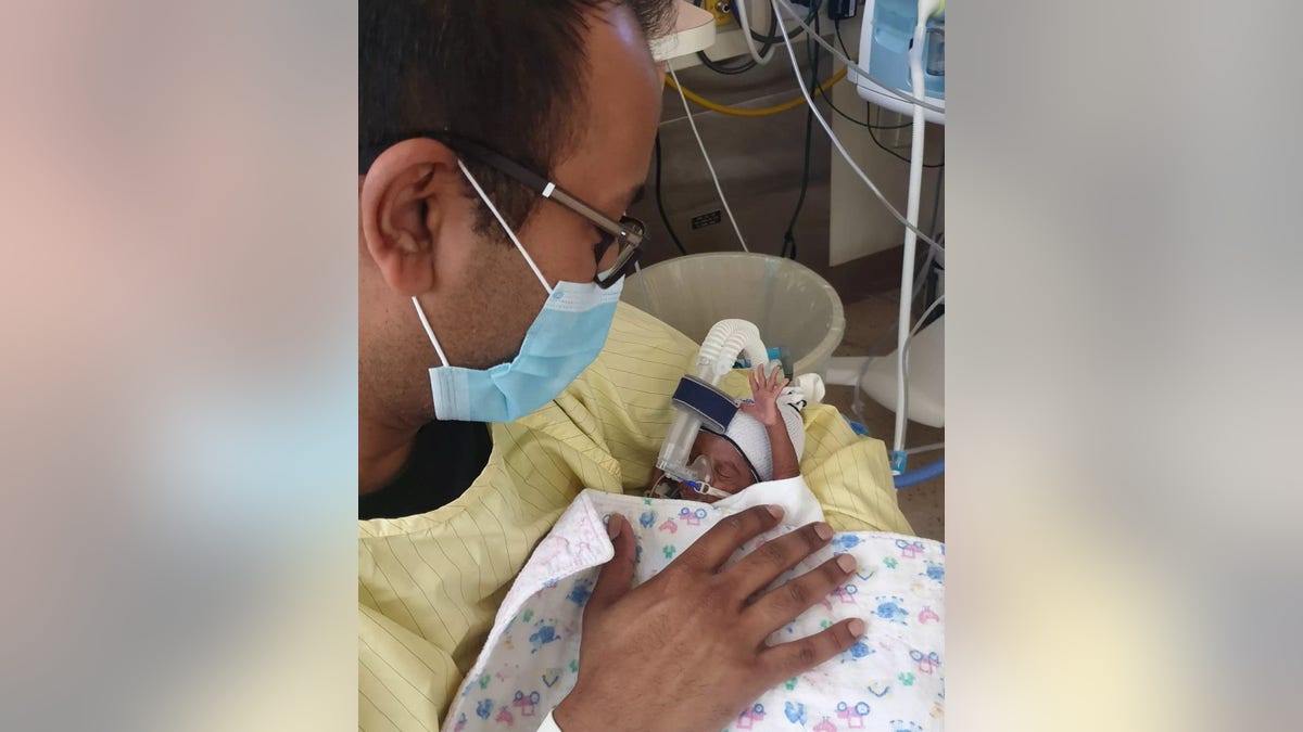 photo of dad with premature baby