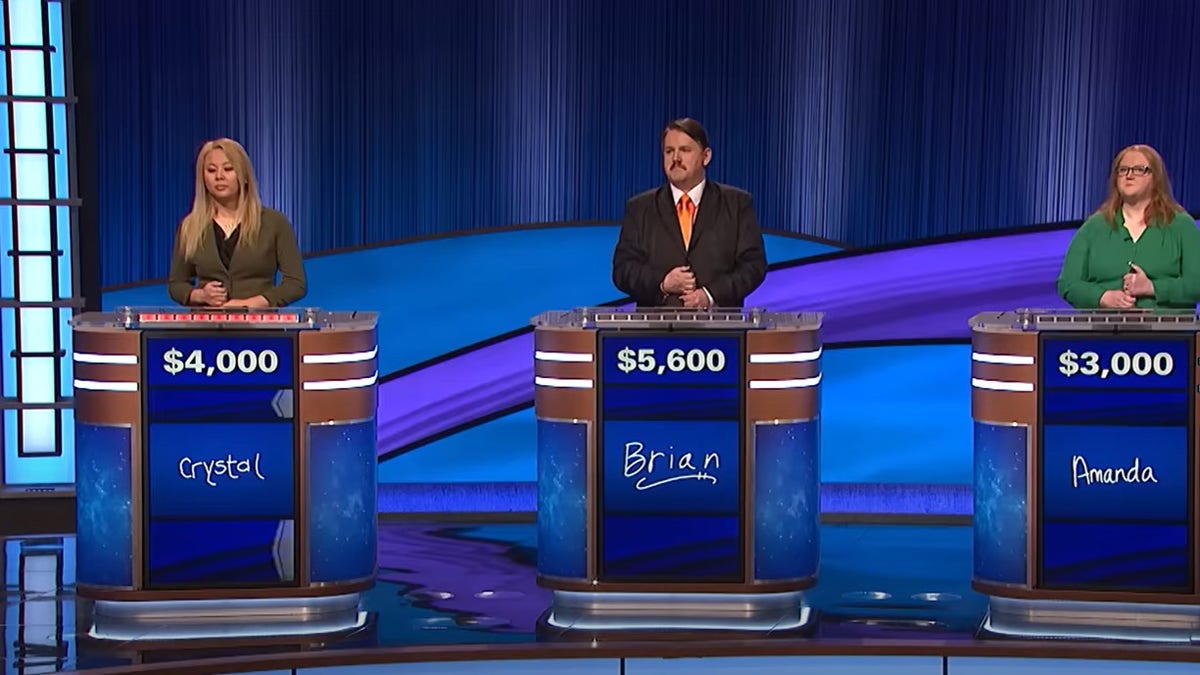 A screenshot of the three contestant's on an episode of "Jeopardy!".