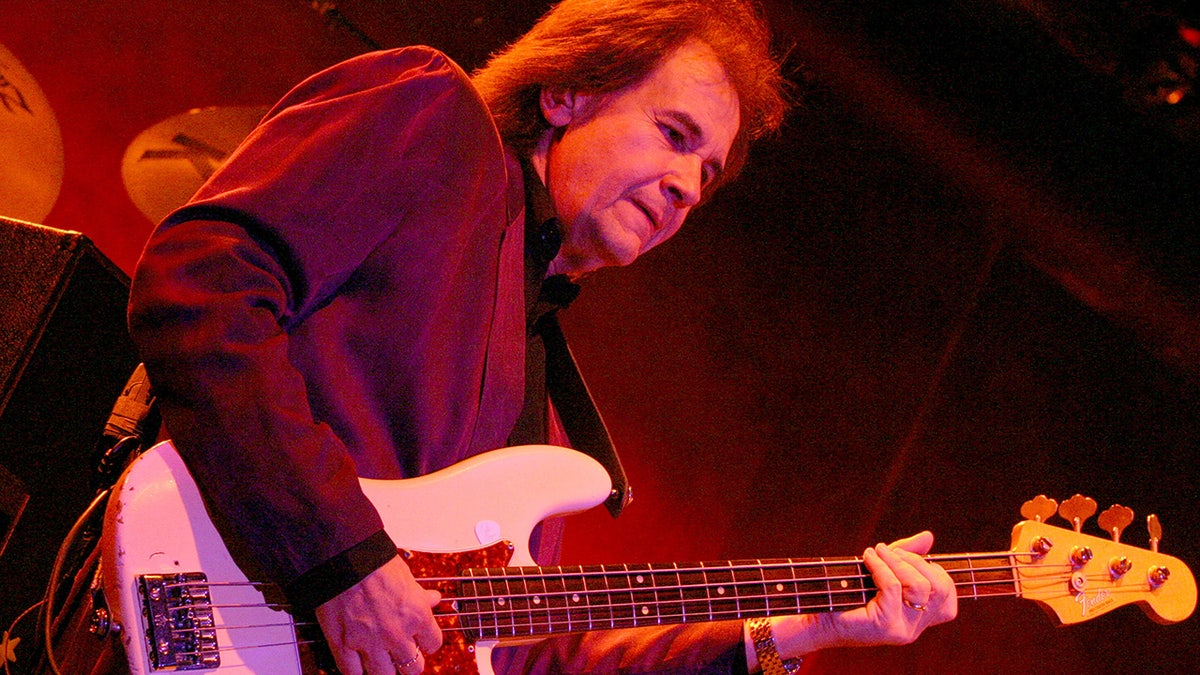 John Regan plays the bass at a concert in 2005